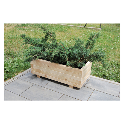 Houten plantenbak 80 cm in naturel hout in een echte tuin 