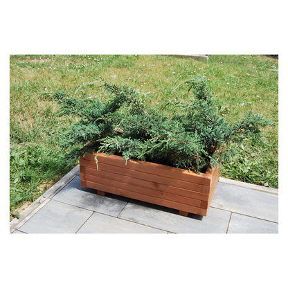 Houten plantenbak 80 cm in walnoot in een echte tuin 